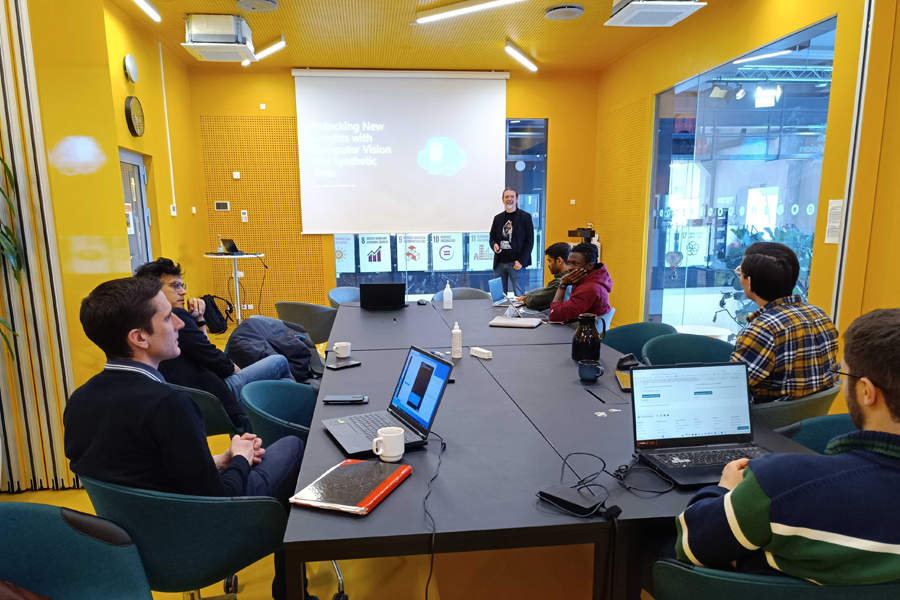 Goran Vuksic presenting to a group of people