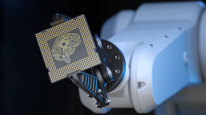 Robotic arm holding a chip Robotic arm holding a chip